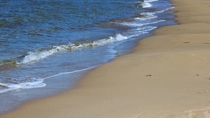 Soft wave on the beach with golden sand