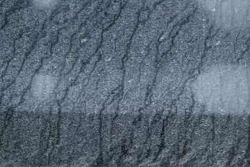 Side view of a very dirty car. Fragment of a dirty car.