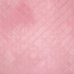 Fototapeta premium a pink diamond pattern on a pink surface 