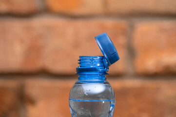 Water in a plastic bottle, European cap close up