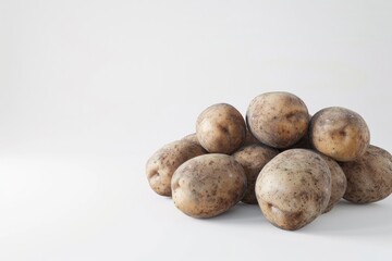 Close up shot of a bunch of potatoes on white background.