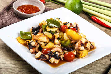 Roasted octopus with vegetables and oil