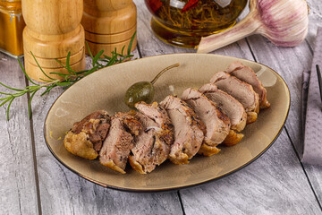 Roasted duck breast slices in the plate