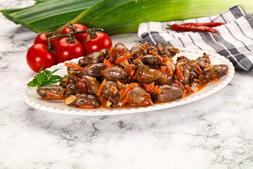 Baked chicken hearts with vegetables