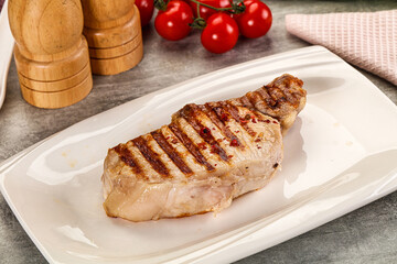 Grilled pork loin steak with bone