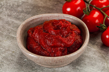 Red tomato paste in the bowl