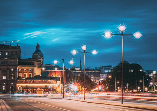 Stockholm, Sweden. Scenic Skyline View Of Famous Tower Of Stockholm City Hall And St. Clara Or Saint Klara Church. Popular Destination Scenic View In Sunset Twilight Dusk Lights. Evening Lighting