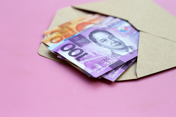 Philippine money, Banknotes on pink background.