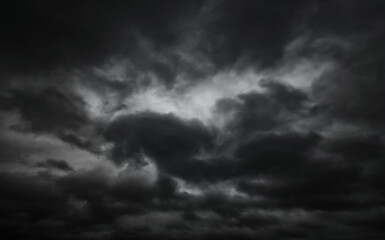 dark dramatic sky with black stormy clouds before rain as abstract background, extreme weather