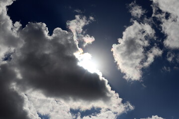 white clouds are floating across the sky