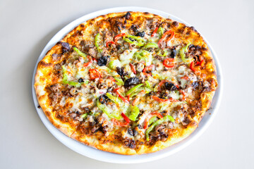 Traditional Turkish cuisine. Pizza, pita, pidesi, sucuk, hummus, kebab. Many dishes on the table. Serving dishes in restaurant. Margherita,  mix, formaggi, veggie karisik pizza. Top view, flat lay
