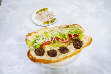 Meatball between bread (Turkish name : ekmek arasi kofte ) Izgara kofte. Manisa, Akcaabat, Akhisar  kofte. Delicious meat grilled meatballs.