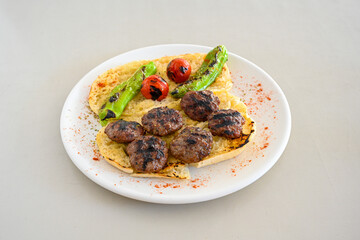 Meatball between bread (Turkish name : ekmek arasi kofte ) Izgara kofte. Manisa, Akcaabat, Akhisar  kofte. Delicious meat grilled meatballs.