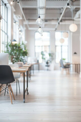 Fototapeta premium Modern, bright, and spacious office interior with large windows, sleek furniture, and natural light creating an open environment.