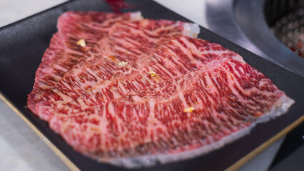 Premium marbled luxury sliced wagyu beef meat for yakiniku grilled steak sukiyaki