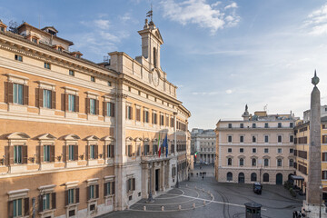 Fototapeta premium Historic government building and obelisk on a sunny day in Rome