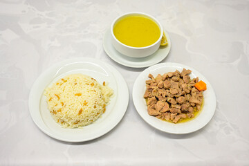 Traditional turkish bulgur pilaf with tomato sause in plate (Turkish name; bulgur pilavi, meyhane pilavi) Pirinc pilavi. Pilavustu tavuk, nohut, kuru fasulye, ciger.