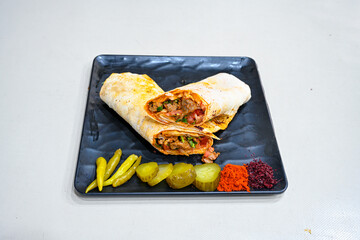 Meat, chicken shawarma kebab with yogurt and fried butter sauce .Tantuni Special. Yogurtlu Mersin...
