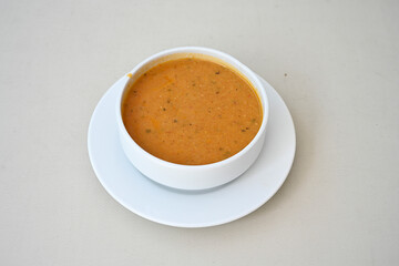 Turkish Ezo Gelin soup, Traditional Turkish Soup. Geleneksel Ezogelin corbasi. Ezogelin Soup Served with a slice of lemon. Top view