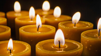 many candles are lit in the dark