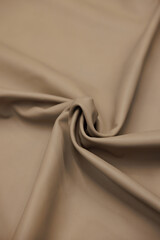 Leather texture: Elegant folds and shading A representation of high quality leather with visible...