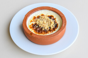 Baked rice pudding turkish milky dessert sutlac, keskul  (Turkish name; firin sutlac). Findikli Hamsikoy Sutlac