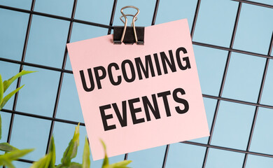 Upcoming Events message on pink sticker. Business concept