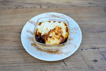 Baked rice pudding turkish milky dessert sutlac, keskul  (Turkish name; firin sutlac). Findikli Hamsikoy Sutlac