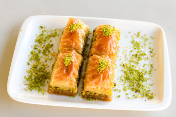 Turkish Dessert Sobiyet, havuc dilimi, midye baklava, mussels baklava and classic baklava with Pistachio . Cikolatali cevizli, fistikli soguk Baklava, top view.