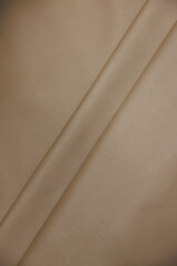 Leather texture: Elegant folds and shading A representation of high quality leather with visible...