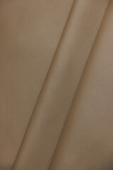 Leather texture: Elegant folds and shading A representation of high quality leather with visible...