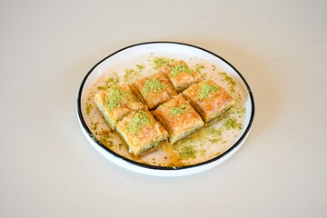 Turkish Dessert Sobiyet, havuc dilimi, midye baklava, mussels baklava and classic baklava with Pistachio . Cikolatali cevizli, fistikli soguk Baklava, top view.