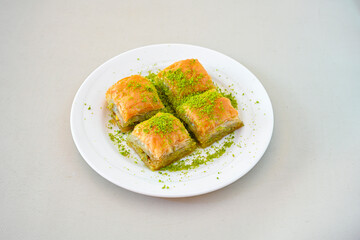 Turkish Dessert Sobiyet, havuc dilimi, midye baklava, mussels baklava and classic baklava with Pistachio . Cikolatali cevizli, fistikli soguk Baklava, top view.