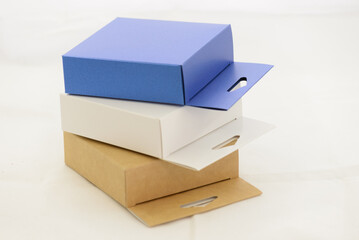 brown white and blue cardboard gift boxes on white background