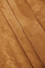 Leather texture: Elegant folds and shading A representation of high quality leather with visible wrinkles and shading that highlight the softness and structure of the material.