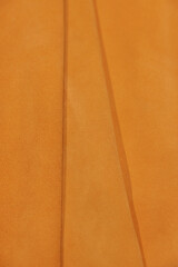 Leather texture: Elegant folds and shading A representation of high quality leather with visible wrinkles and shading that highlight the softness and structure of the material.