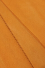 Leather texture: Elegant folds and shading A representation of high quality leather with visible wrinkles and shading that highlight the softness and structure of the material.