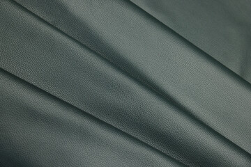 Leather texture: Elegant folds and shading A representation of high quality leather with visible wrinkles and shading that highlight the softness and structure of the material.