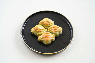 Turkish Dessert Sobiyet, havuc dilimi, midye baklava, mussels baklava and classic baklava with Pistachio . Cikolatali cevizli, fistikli soguk Baklava, top view.