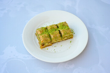 Turkish Dessert Sobiyet, havuc dilimi, midye baklava, mussels baklava and classic baklava with Pistachio . Cikolatali cevizli, fistikli soguk Baklava, top view.