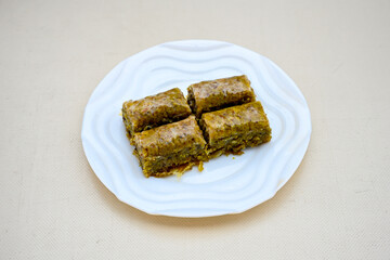 Turkish Dessert Sobiyet, havuc dilimi, midye baklava, mussels baklava and classic baklava with Pistachio . Cikolatali cevizli, fistikli soguk Baklava, top view.