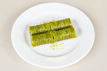 Turkish Dessert Sobiyet, havuc dilimi, midye baklava, mussels baklava and classic baklava with Pistachio . Cikolatali cevizli, fistikli soguk Baklava, top view.