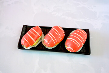 Ekler Pasta Turkish delicious ekler pasta with plate. Klasik, cikolatali, muzlu, frambuazli, karamelli, cilekli, oreolu ekler.