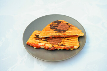 Turkish karisik atom kare  tost ( kasarli bazlama tost) . Sucuklu, Kasarli,  cheddarli, kavurmali karisik tost. Flat baked bread toasted. Karisik bazlama tost .