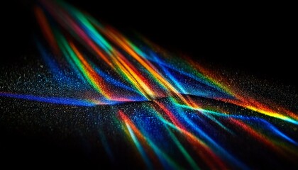 Light refraction prisms breaking light in to colorful beams close up with dark background