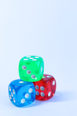 Colorful dices on a white background, closeup of photo	