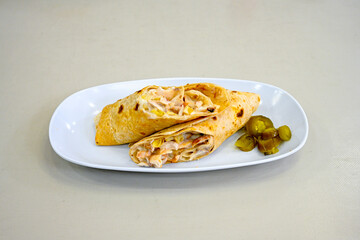 Lavash doner kebab ( soslu kasarli zurna doner durum )  or shawarma sliced in plate isolated.  Tavuk Et Doner Durum. Hatay Iskenderun usulu bazuka, zurna  tavuk doner durum. 