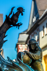 Fototapeta premium Figuren an einem Brunnen