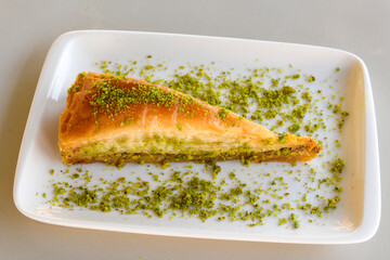 Turkish Dessert Sobiyet, havuc dilimi, midye baklava, mussels baklava and classic baklava with Pistachio . Cikolatali cevizli, fistikli soguk Baklava, top view.