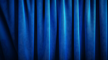 Close-up of a blue curtain with vertical folds, spotlighted in a theater setting, showcasing rich blackout fabric texture.